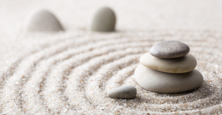 rocks in a pile in sand for relaxation
