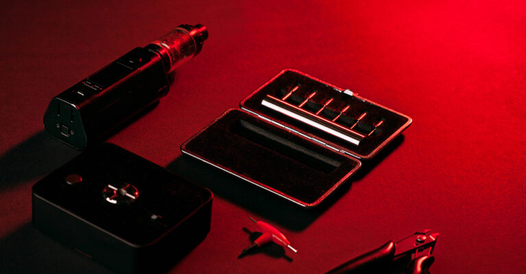 vape equipment on a red backdrop