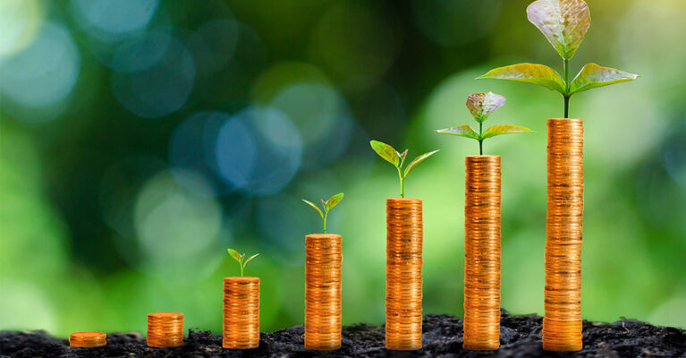 Coins growing with plant sprouts