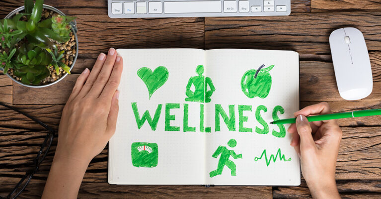 Notebook with wellness goals written on it